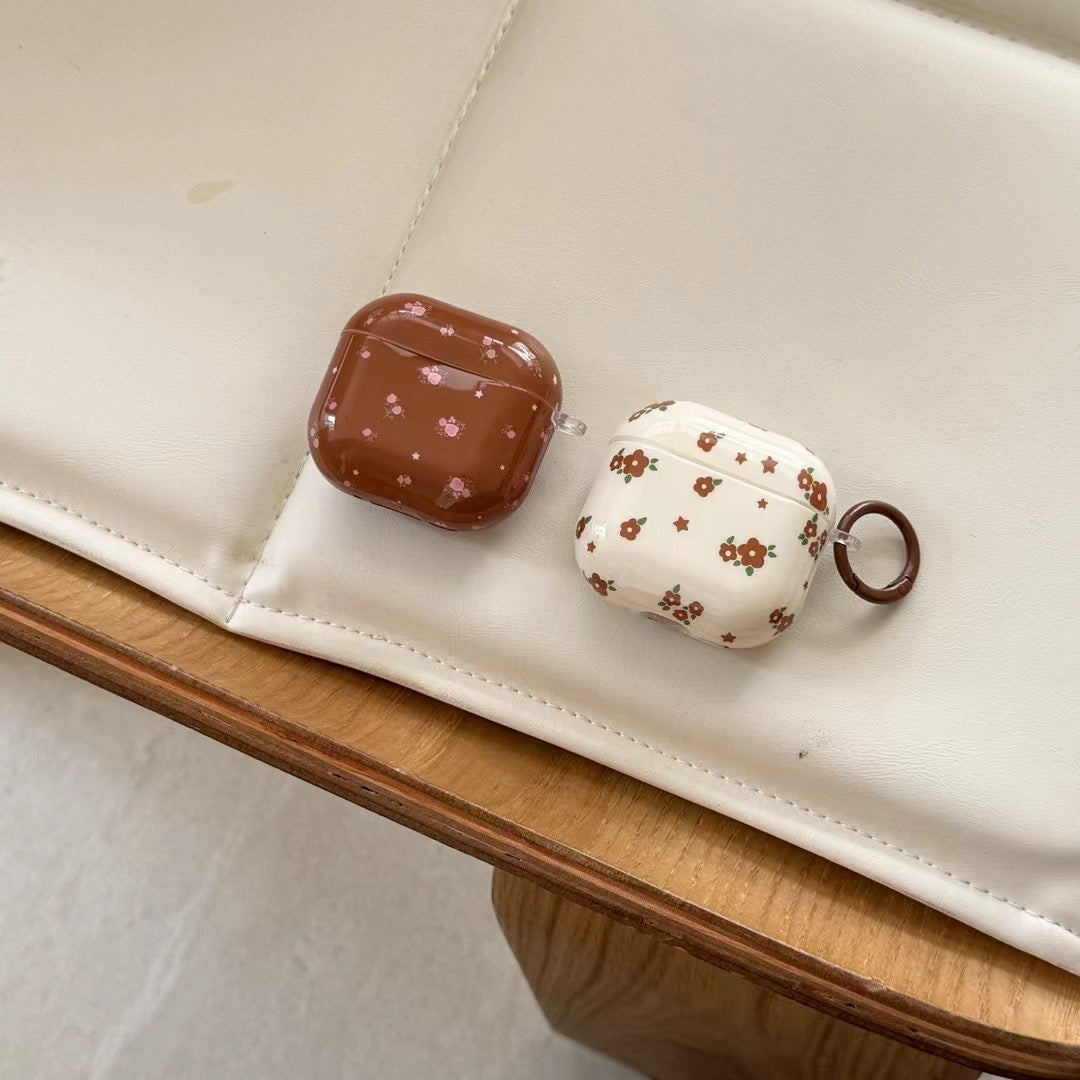Niedliche AirPods-Hülle mit Blumenmuster
