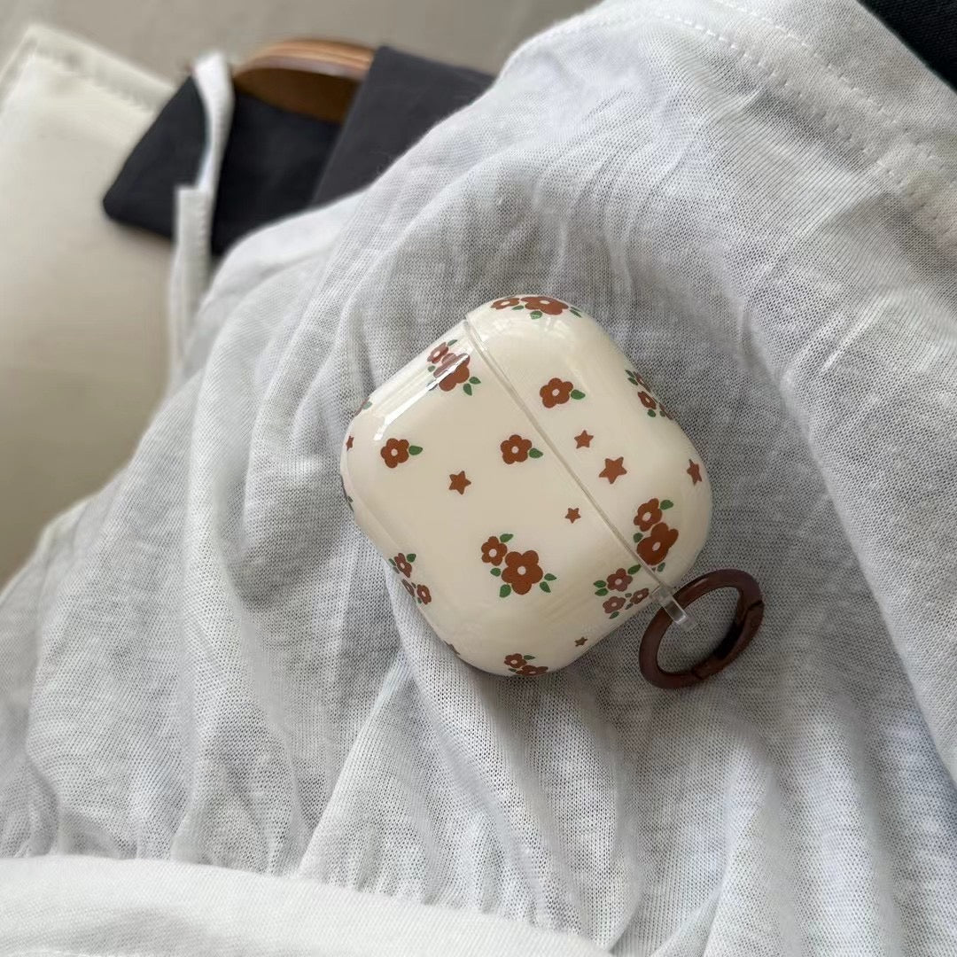 Niedliche AirPods-Hülle mit Blumenmuster