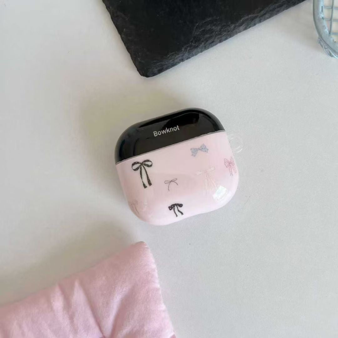 Ovitek za slušalke AirPods z roza pentljo in obeskom s trakom
