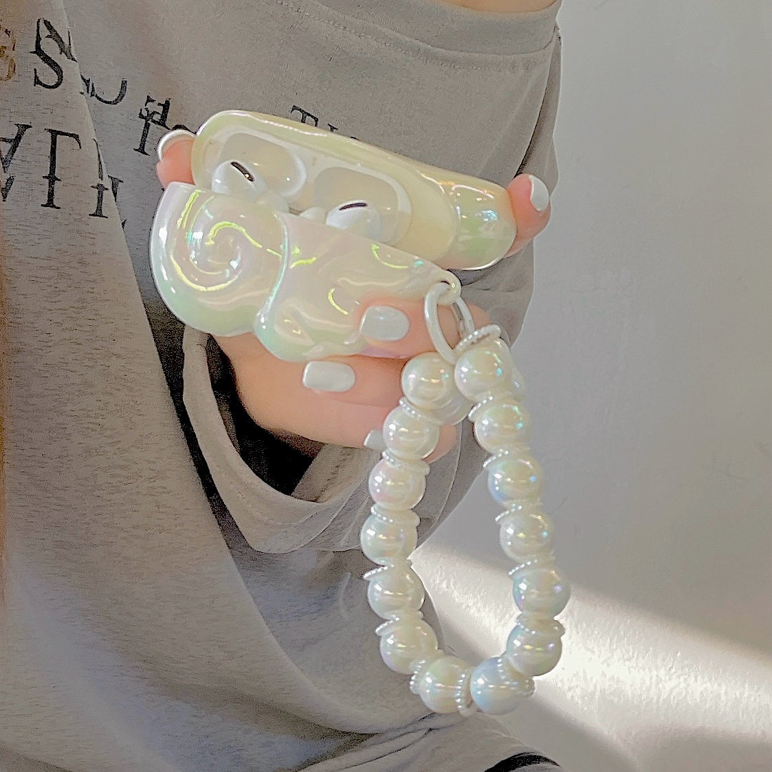 Sciathán Aingeal Cás AirPods le Péarla & Suath Feirbeach